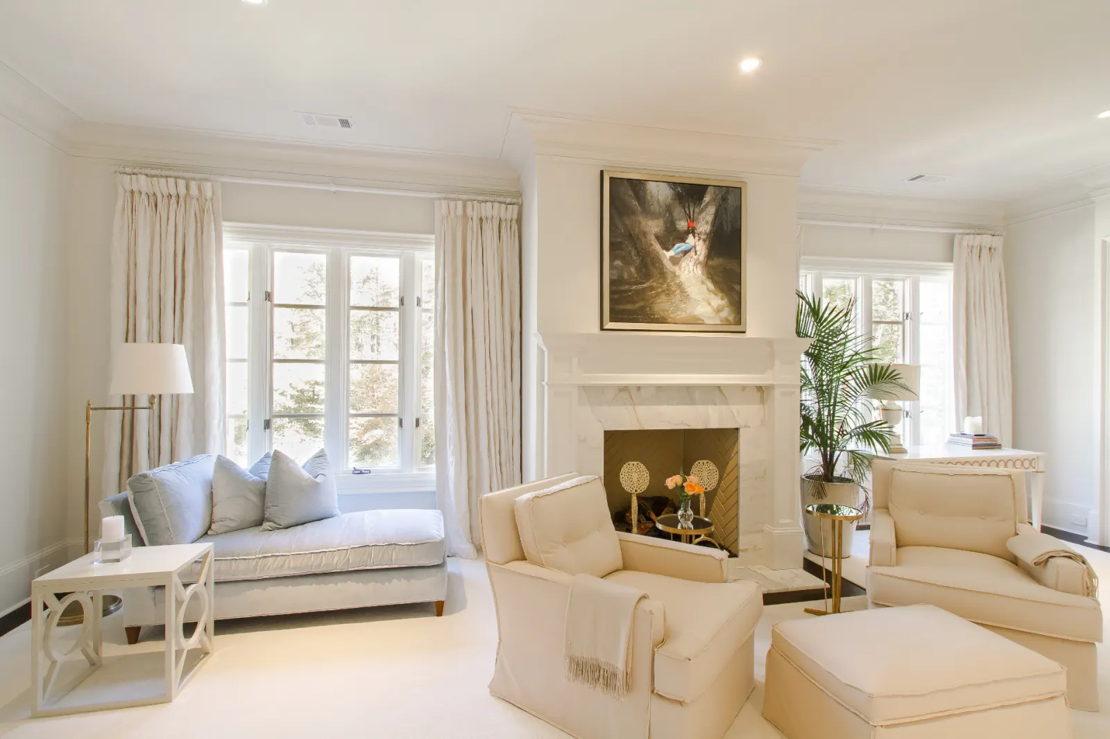 Living room with custom drapery framing tall windows