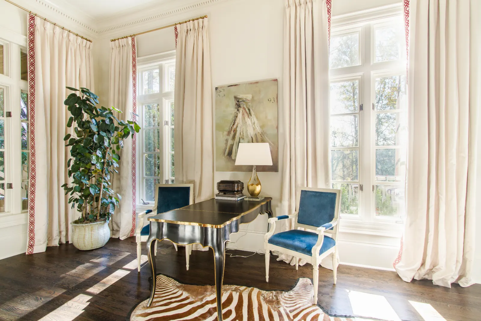 Sunlit office with custom trimmed drapery panels